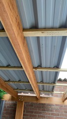 Roof install in progress, showing purlins