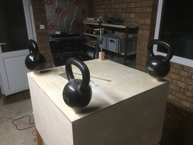 Kettlebells used whilst the glue sets