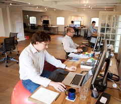 The old office layout. Rob's exercise ball giving us startup credit